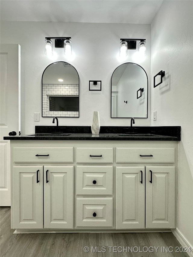 bathroom featuring vanity and wood-type flooring