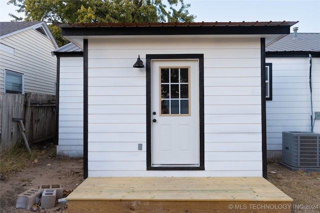 view of outdoor structure featuring central AC