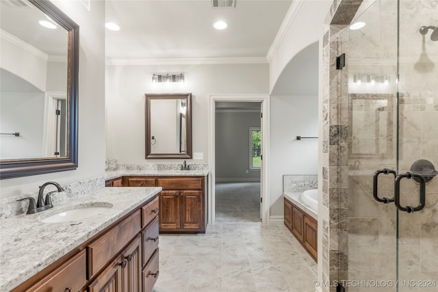 bathroom with vanity, shower with separate bathtub, and ornamental molding