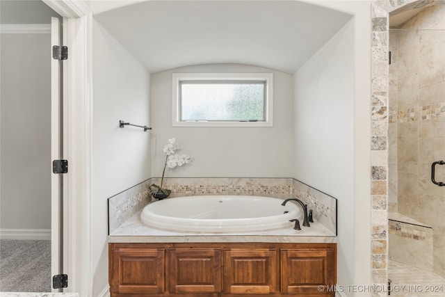 bathroom with vaulted ceiling and plus walk in shower