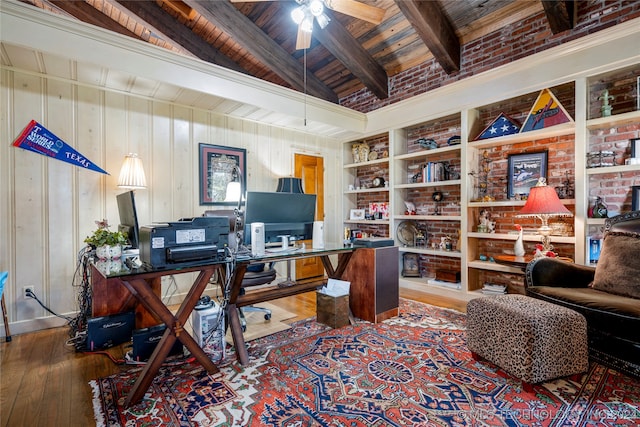 home office featuring hardwood / wood-style floors, ceiling fan, wooden ceiling, vaulted ceiling with beams, and wooden walls