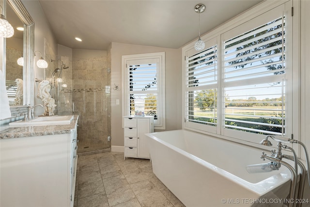 bathroom with vanity, lofted ceiling, and plus walk in shower