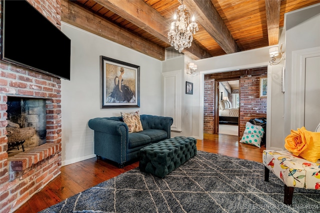 living room with dark wood-type flooring, wood ceiling, beam ceiling, and a fireplace