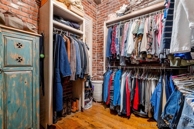 walk in closet featuring hardwood / wood-style flooring