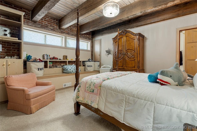 bedroom with beamed ceiling, carpet flooring, and wooden ceiling