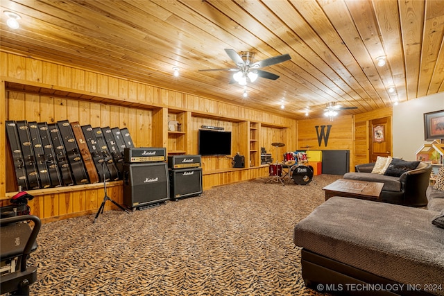 carpeted living room featuring wood ceiling, wooden walls, and ceiling fan