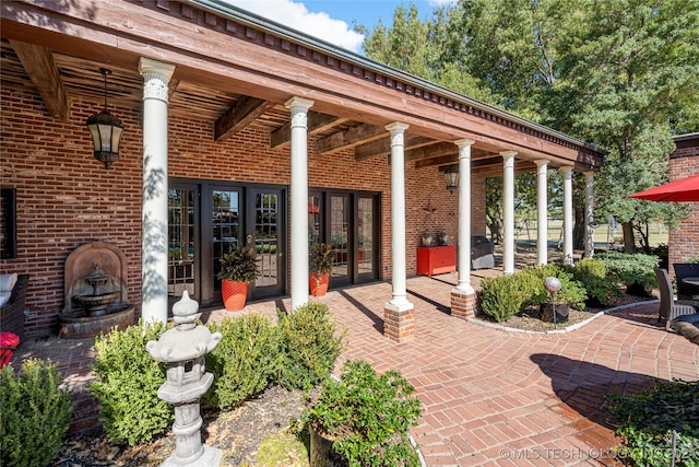 view of patio featuring french doors and a grill