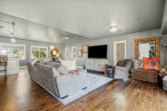 living room featuring ceiling fan, lofted ceiling, and dark hardwood / wood-style floors