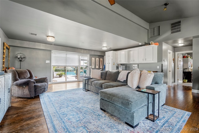 living room with dark hardwood / wood-style floors