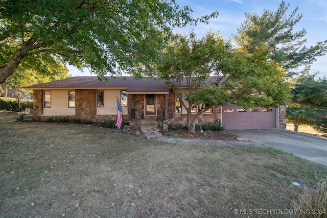 ranch-style house with a front lawn and a garage