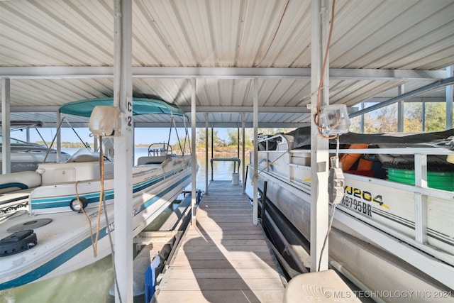 dock area with a water view