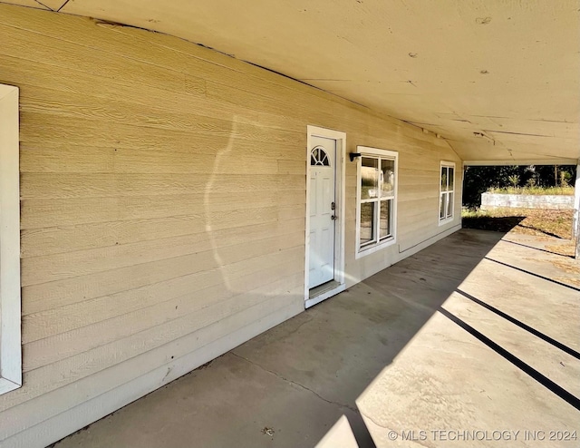entrance to property with a patio area