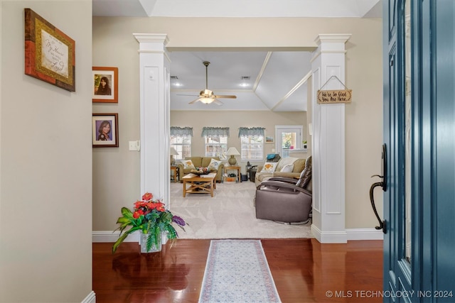 entrance foyer featuring ceiling fan, decorative columns, and dark hardwood / wood-style flooring