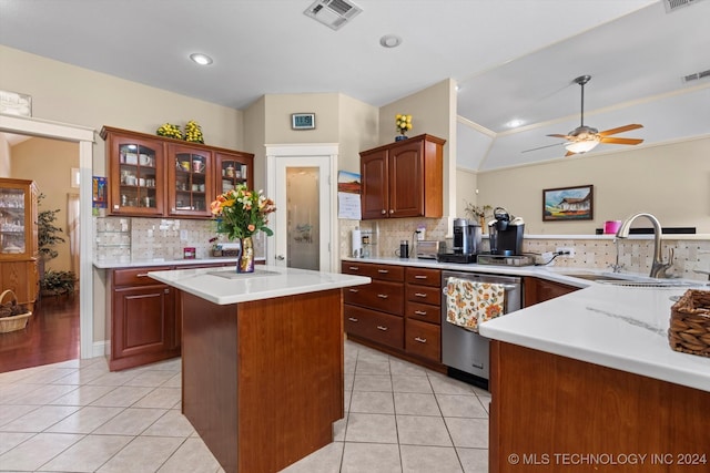 kitchen featuring kitchen peninsula, stainless steel dishwasher, backsplash, and crown molding