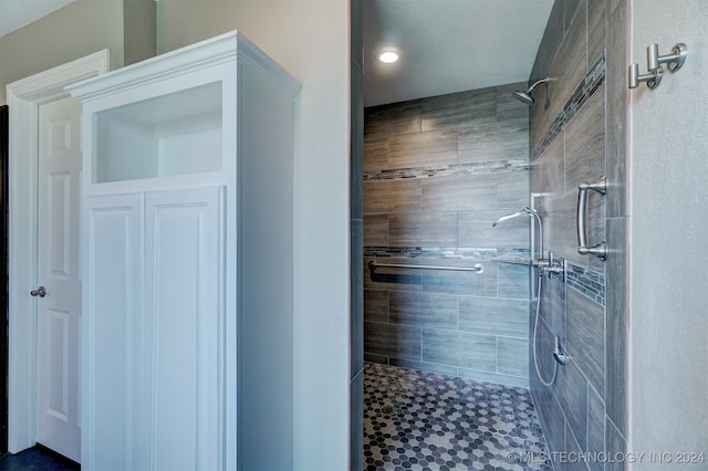 bathroom with tiled shower