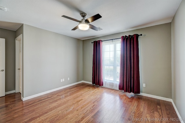 unfurnished room with light hardwood / wood-style floors and ceiling fan