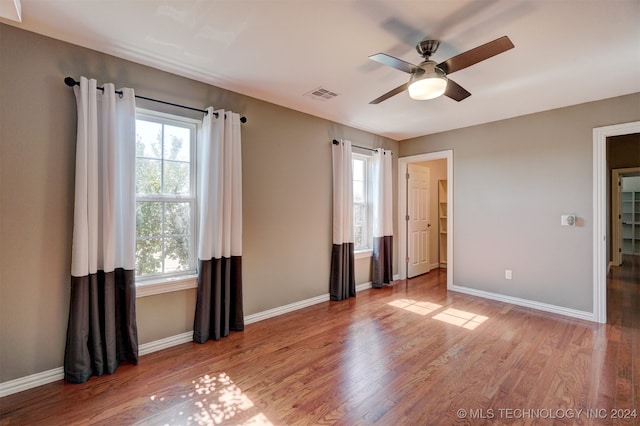 unfurnished bedroom with light wood-type flooring and ceiling fan