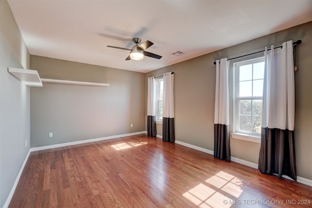 unfurnished bedroom featuring wood-type flooring and ceiling fan