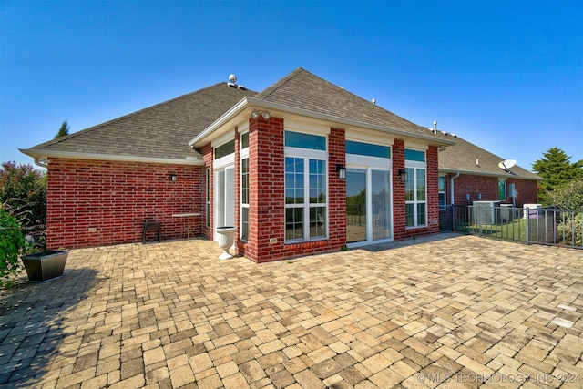 rear view of house featuring a patio