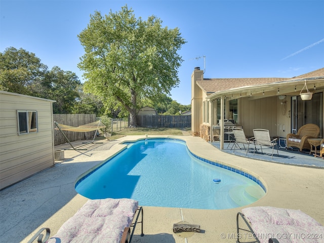 view of pool featuring a patio area