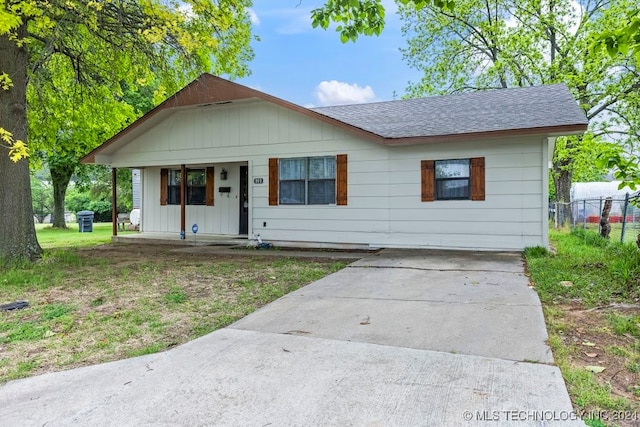 bungalow-style house with a front lawn