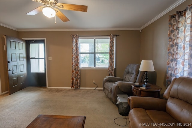 carpeted living room with ornamental molding and ceiling fan