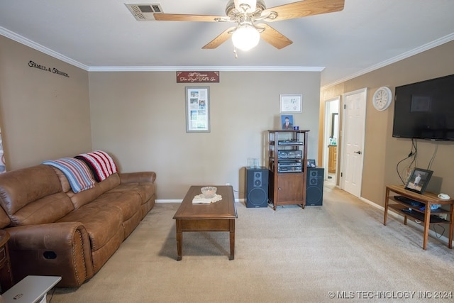 living room with crown molding, light colored carpet, and ceiling fan