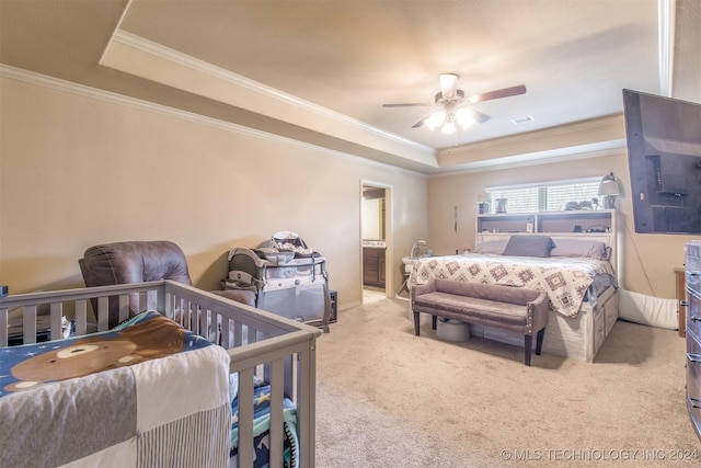 carpeted bedroom with crown molding, a raised ceiling, ceiling fan, and visible vents