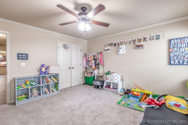 recreation room featuring ceiling fan, ornamental molding, and carpet