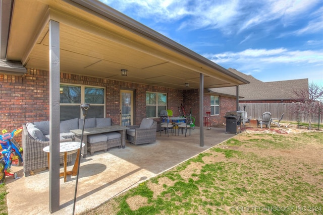 view of patio / terrace with outdoor lounge area, fence, and a grill