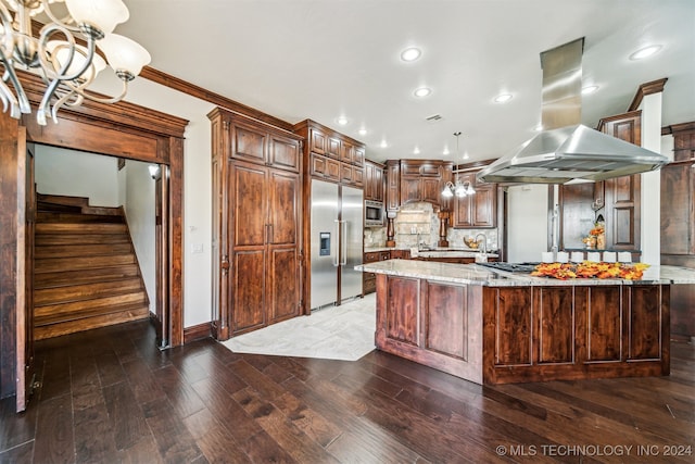 kitchen with built in appliances, a large island, dark hardwood / wood-style flooring, and island range hood