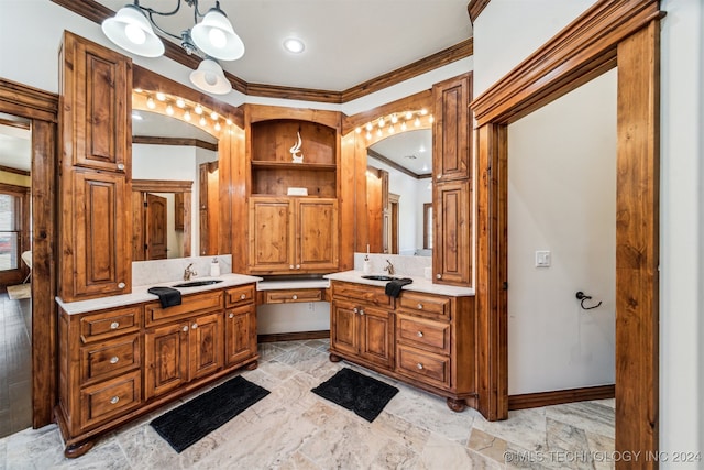 bathroom with vanity, a notable chandelier, and ornamental molding