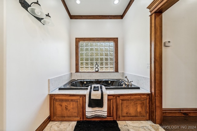 bathroom featuring a tub to relax in and ornamental molding