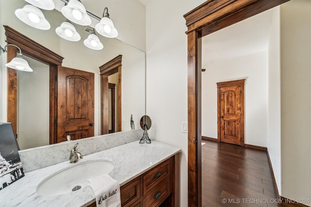 bathroom with vanity and hardwood / wood-style flooring