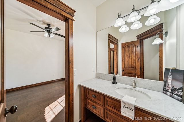 bathroom featuring vanity, wood-type flooring, and ceiling fan