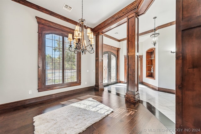 dining area with french doors, crown molding, a healthy amount of sunlight, and dark hardwood / wood-style floors