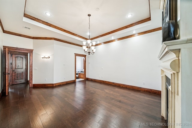 interior space featuring crown molding, a tray ceiling, and dark hardwood / wood-style floors