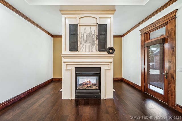 unfurnished living room featuring ornamental molding and dark hardwood / wood-style floors