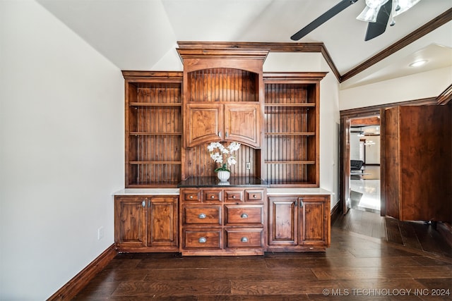 unfurnished office with ornamental molding, vaulted ceiling, ceiling fan, and dark hardwood / wood-style flooring