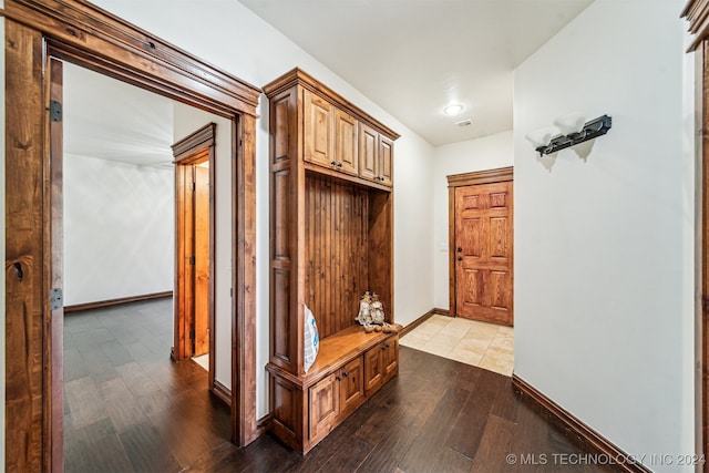 mudroom with wood-type flooring