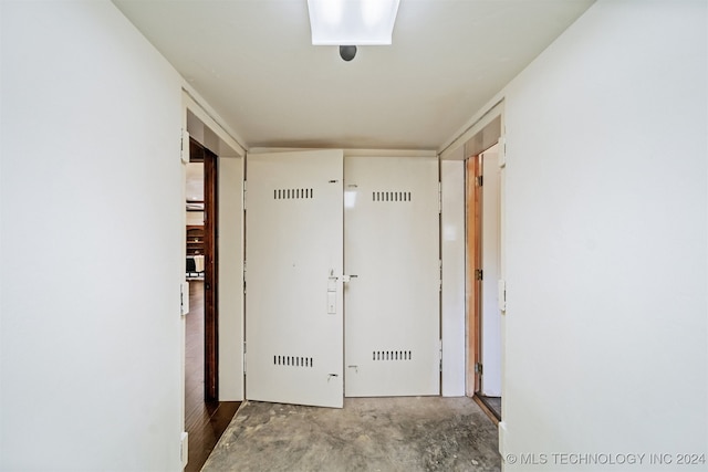 corridor featuring concrete flooring