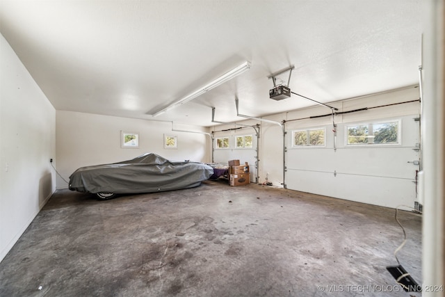 garage featuring a garage door opener