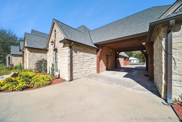 view of home's exterior featuring a carport