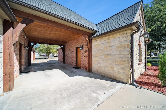 view of vehicle parking with a carport