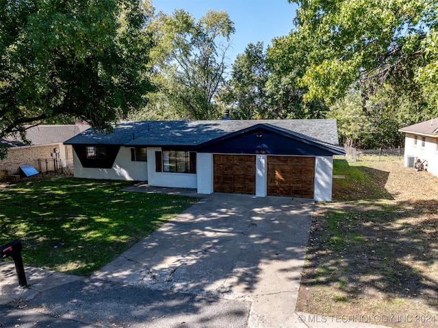 ranch-style house with a front lawn and a garage