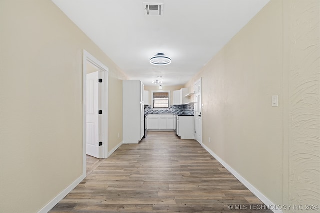 hall with light hardwood / wood-style floors