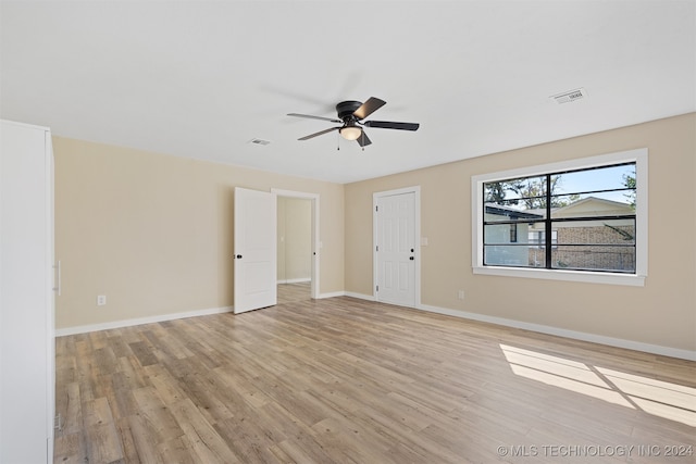 spare room featuring ceiling fan and light hardwood / wood-style flooring