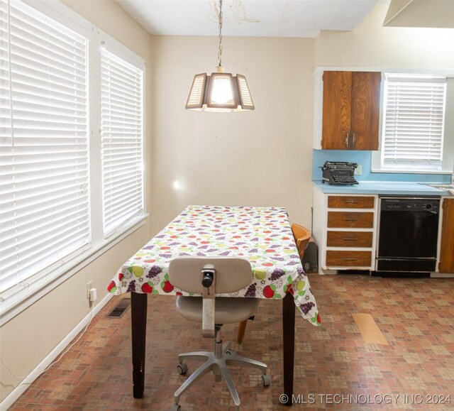 921 D NW, Ardmore, OK 73401 - dining room featuring brick floors and plenty of natural light
