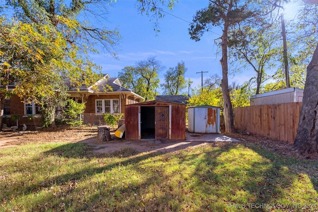 view of outbuilding featuring a yard