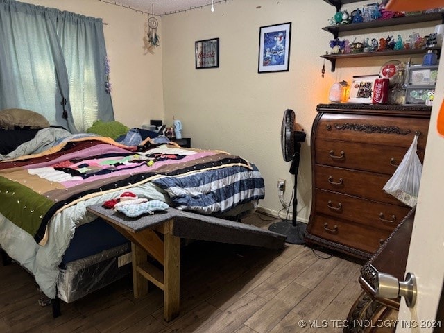 bedroom with light hardwood / wood-style flooring